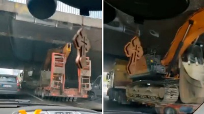 DALJE NEĆE MOĆI Kamion koji prevozi radnu mašinu se ZAGLAVIO ispod nadvožnjaka (VIDEO)